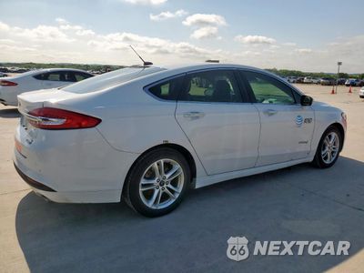 Trzecie zdjęcie samochodu z tyłu: 2018 FORD FUSION SE HYBRID VIN:3FA6P0LU4JR118645 - miniatura