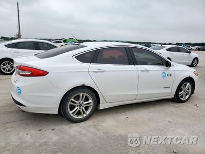 Trzecie zdjęcie samochodu z tyłu: 2018 FORD FUSION SE HYBRID VIN:3FA6P0LU2JR171828 - miniatura