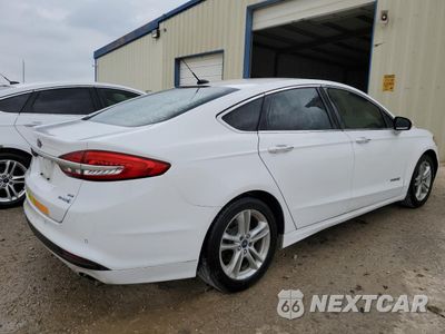 Trzecie zdjęcie samochodu z tyłu: 2018 FORD FUSION SE HYBRID VIN:3FA6P0LU9JR171888 - miniatura
