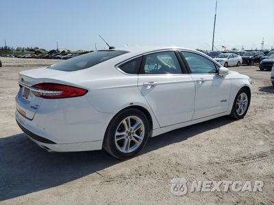 Trzecie zdjęcie samochodu z tyłu: 2018 FORD FUSION SE HYBRID VIN:3FA6P0LU2JR163518 - miniatura