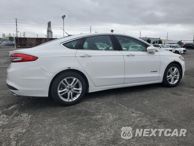 Trzecie zdjęcie samochodu z tyłu: 2018 FORD FUSION SE HYBRID VIN:3FA6P0LU6JR278641 - miniatura