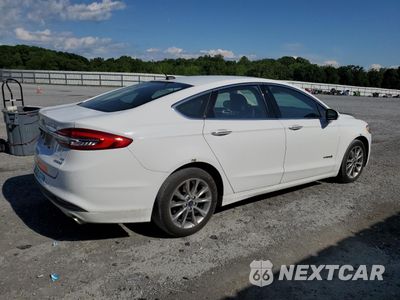 Trzecie zdjęcie samochodu z tyłu: 2017 FORD FUSION SE HYBRID VIN:3FA6P0LUXHR409211 - miniatura