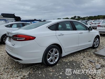 Trzecie zdjęcie samochodu z tyłu: 2018 FORD FUSION SE HYBRID VIN:3FA6P0LU7JR171727 - miniatura