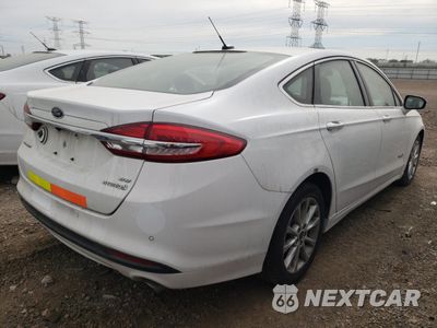 Trzecie zdjęcie samochodu z tyłu: 2017 FORD FUSION SE HYBRID VIN:3FA6P0LU3HR409101 - miniatura