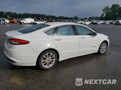 Trzecie zdjęcie samochodu z tyłu: 2017 FORD FUSION SE HYBRID VIN:3FA6P0LU3HR409583 - miniatura