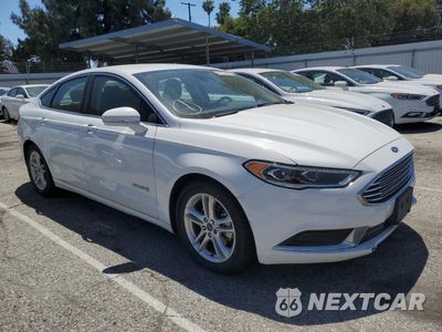 Czwarte zdjęcie samochodu z boku: 2018 FORD FUSION SE HYBRID VIN:3FA6P0LUXJR171530 - miniatura