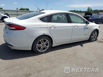 Trzecie zdjęcie samochodu z tyłu: 2018 FORD FUSION SE HYBRID VIN:3FA6P0LU2JR163485 - miniatura
