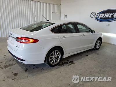 Trzecie zdjęcie samochodu z tyłu: 2017 FORD FUSION SE HYBRID VIN:3FA6P0LUXHR410147 - miniatura