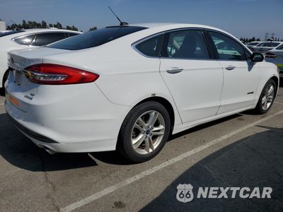 Trzecie zdjęcie samochodu z tyłu: 2018 FORD FUSION SE HYBRID VIN:3FA6P0LU7JR278633 - miniatura
