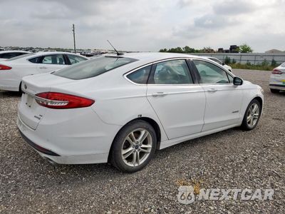 Trzecie zdjęcie samochodu z tyłu: 2018 FORD FUSION SE HYBRID VIN:3FA6P0LU0JR118772 - miniatura