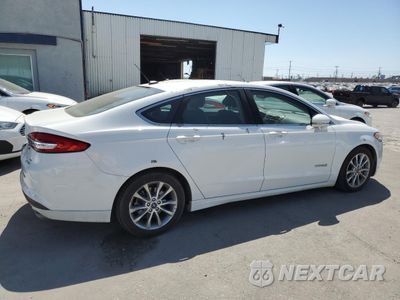 Trzecie zdjęcie samochodu z tyłu: 2017 FORD FUSION SE HYBRID VIN:3FA6P0LUXHR409287 - miniatura