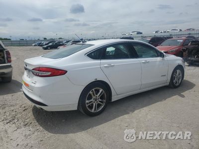 Trzecie zdjęcie samochodu z tyłu: 2018 FORD FUSION SE HYBRID VIN:3FA6P0LU3JR171997 - miniatura