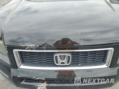Zdjęcie 11 z 14 samochodu: 2007 HONDA RIDGELINE RTX VIN:2HJYK16387H507380 - miniatura