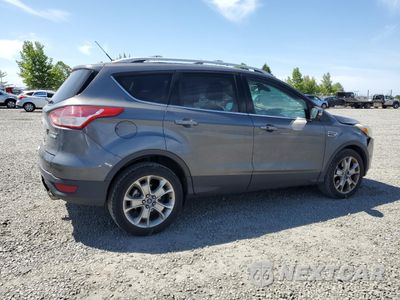 Trzecie zdjęcie samochodu z tyłu: 2014 FORD ESCAPE TITANIUM VIN:1FMCU0J91EUB04913 - miniatura