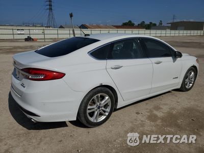 Trzecie zdjęcie samochodu z tyłu: 2018 FORD FUSION SE HYBRID VIN:3FA6P0LU3JR171899 - miniatura