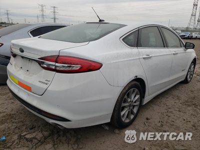 Trzecie zdjęcie samochodu z tyłu: 2017 FORD FUSION SE HYBRID VIN:3FA6P0LUXHR409063 - miniatura