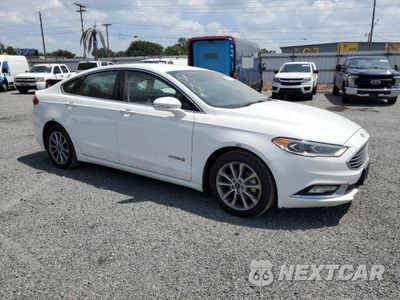 Czwarte zdjęcie samochodu z boku: 2017 FORD FUSION SE HYBRID VIN:3FA6P0LUXHR409645 - miniatura
