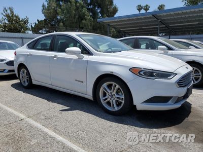 Czwarte zdjęcie samochodu z boku: 2018 FORD FUSION SE HYBRID VIN:3FA6P0LU1JR118697 - miniatura