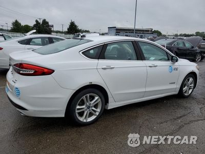 Trzecie zdjęcie samochodu z tyłu: 2018 FORD FUSION SE HYBRID VIN:3FA6P0LU1JR118859 - miniatura