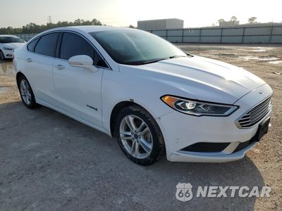 Czwarte zdjęcie samochodu z boku: 2018 FORD FUSION SE HYBRID VIN:3FA6P0LU1JR129862 - miniatura