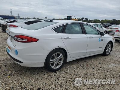 Trzecie zdjęcie samochodu z tyłu: 2018 FORD FUSION SE HYBRID VIN:3FA6P0LU5JR163514 - miniatura