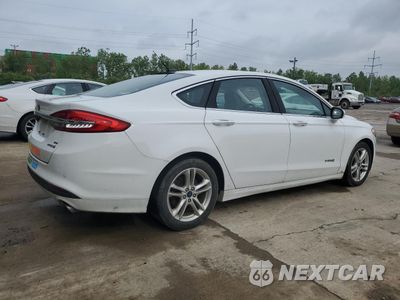 Trzecie zdjęcie samochodu z tyłu: 2018 FORD FUSION SE HYBRID VIN:3FA6P0LU3JR118815 - miniatura