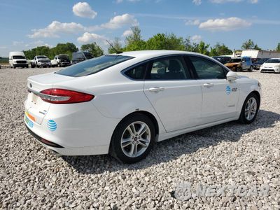 Trzecie zdjęcie samochodu z tyłu: 2018 FORD FUSION SE HYBRID VIN:3FA6P0LU6JR171847 - miniatura