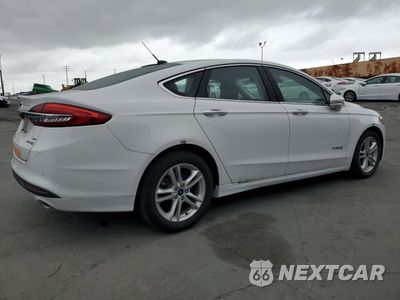 Trzecie zdjęcie samochodu z tyłu: 2018 FORD FUSION SE HYBRID VIN:3FA6P0LU4JR178473 - miniatura
