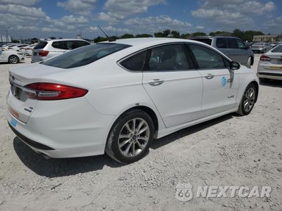 Trzecie zdjęcie samochodu z tyłu: 2017 FORD FUSION SE HYBRID VIN:3FA6P0LU1HR410120 - miniatura