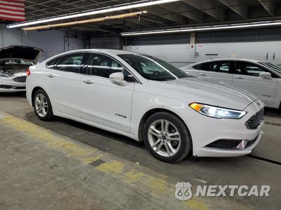 Czwarte zdjęcie samochodu z boku: 2018 FORD FUSION SE HYBRID VIN:3FA6P0LU9JR118799 - miniatura