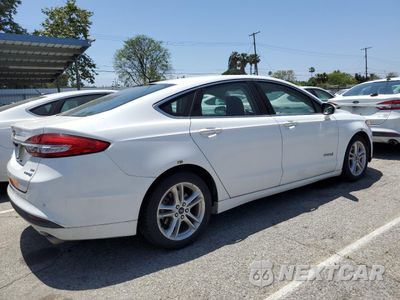 Trzecie zdjęcie samochodu z tyłu: 2018 FORD FUSION SE HYBRID VIN:3FA6P0LU1JR118697 - miniatura