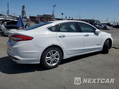 Trzecie zdjęcie samochodu z tyłu: 2018 FORD FUSION SE HYBRID VIN:3FA6P0LU4JR171569 - miniatura