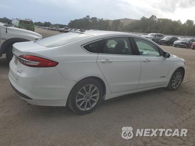 Trzecie zdjęcie samochodu z tyłu: 2017 FORD FUSION SE HYBRID VIN:3FA6P0LU4HR409575 - miniatura