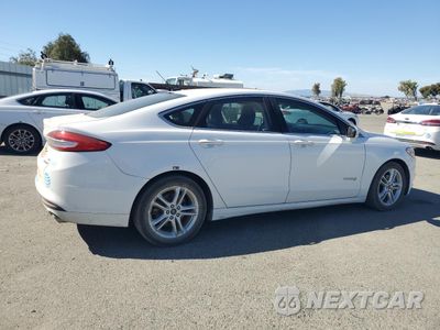 Trzecie zdjęcie samochodu z tyłu: 2018 FORD FUSION SE HYBRID VIN:3FA6P0LU3JR118880 - miniatura