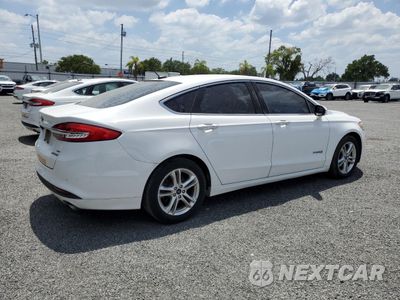 Trzecie zdjęcie samochodu z tyłu: 2018 FORD FUSION SE HYBRID VIN:3FA6P0LU2JR171733 - miniatura
