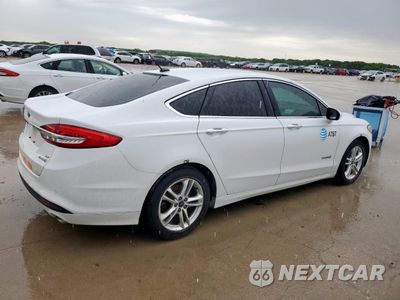 Trzecie zdjęcie samochodu z tyłu: 2018 FORD FUSION SE HYBRID VIN:3FA6P0LU6JR172058 - miniatura
