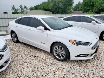 Czwarte zdjęcie samochodu z boku: 2017 FORD FUSION SE HYBRID VIN:3FA6P0LU5HR409553 - miniatura