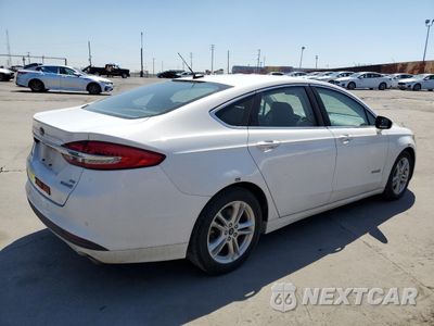 Trzecie zdjęcie samochodu z tyłu: 2018 FORD FUSION SE HYBRID VIN:3FA6P0LU1JR172131 - miniatura