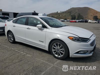 Czwarte zdjęcie samochodu z boku: 2017 FORD FUSION SE HYBRID VIN:3FA6P0LU2HR409736 - miniatura