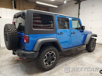 Trzecie zdjęcie samochodu z tyłu: 2015 JEEP WRANGLER UNLIMITED RUBICON VIN:1C4BJWFG1FL709704 - miniatura