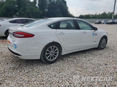 Trzecie zdjęcie samochodu z tyłu: 2017 FORD FUSION SE HYBRID VIN:3FA6P0LU9HR145852 - miniatura