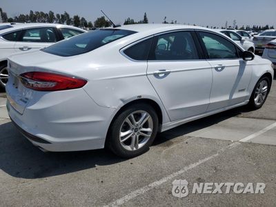 Trzecie zdjęcie samochodu z tyłu: 2018 FORD FUSION SE HYBRID VIN:3FA6P0LU3JR172115 - miniatura
