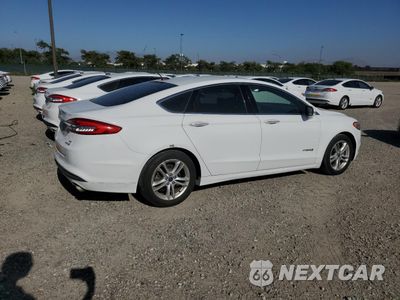 Trzecie zdjęcie samochodu z tyłu: 2018 FORD FUSION SE HYBRID VIN:3FA6P0LU0JR171570 - miniatura