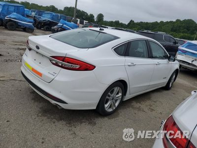 Trzecie zdjęcie samochodu z tyłu: 2018 FORD FUSION SE HYBRID VIN:3FA6P0LU2JR171974 - miniatura