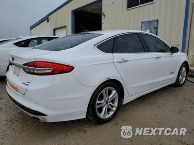 Trzecie zdjęcie samochodu z tyłu: 2018 FORD FUSION SE HYBRID VIN:3FA6P0LU9JR171812 - miniatura