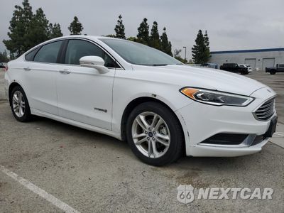 Czwarte zdjęcie samochodu z boku: 2018 FORD FUSION SE HYBRID VIN:3FA6P0LU6JR278638 - miniatura