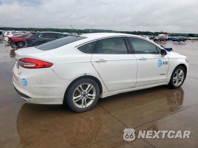 Trzecie zdjęcie samochodu z tyłu: 2018 FORD FUSION SE HYBRID VIN:3FA6P0LU0JR129805 - miniatura