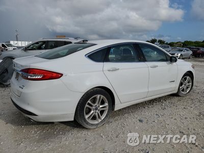 Trzecie zdjęcie samochodu z tyłu: 2018 FORD FUSION SE HYBRID VIN:3FA6P0LU2JR171909 - miniatura