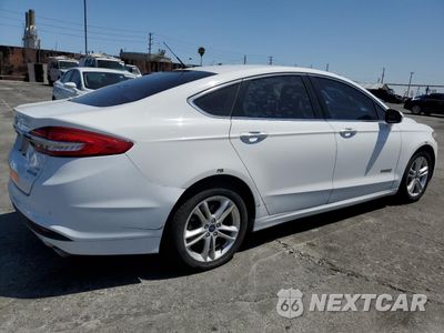 Trzecie zdjęcie samochodu z tyłu: 2018 FORD FUSION SE HYBRID VIN:3FA6P0LU0JR118674 - miniatura