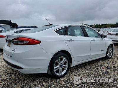 Trzecie zdjęcie samochodu z tyłu: 2018 FORD FUSION SE HYBRID VIN:3FA6P0LU4JR118788 - miniatura